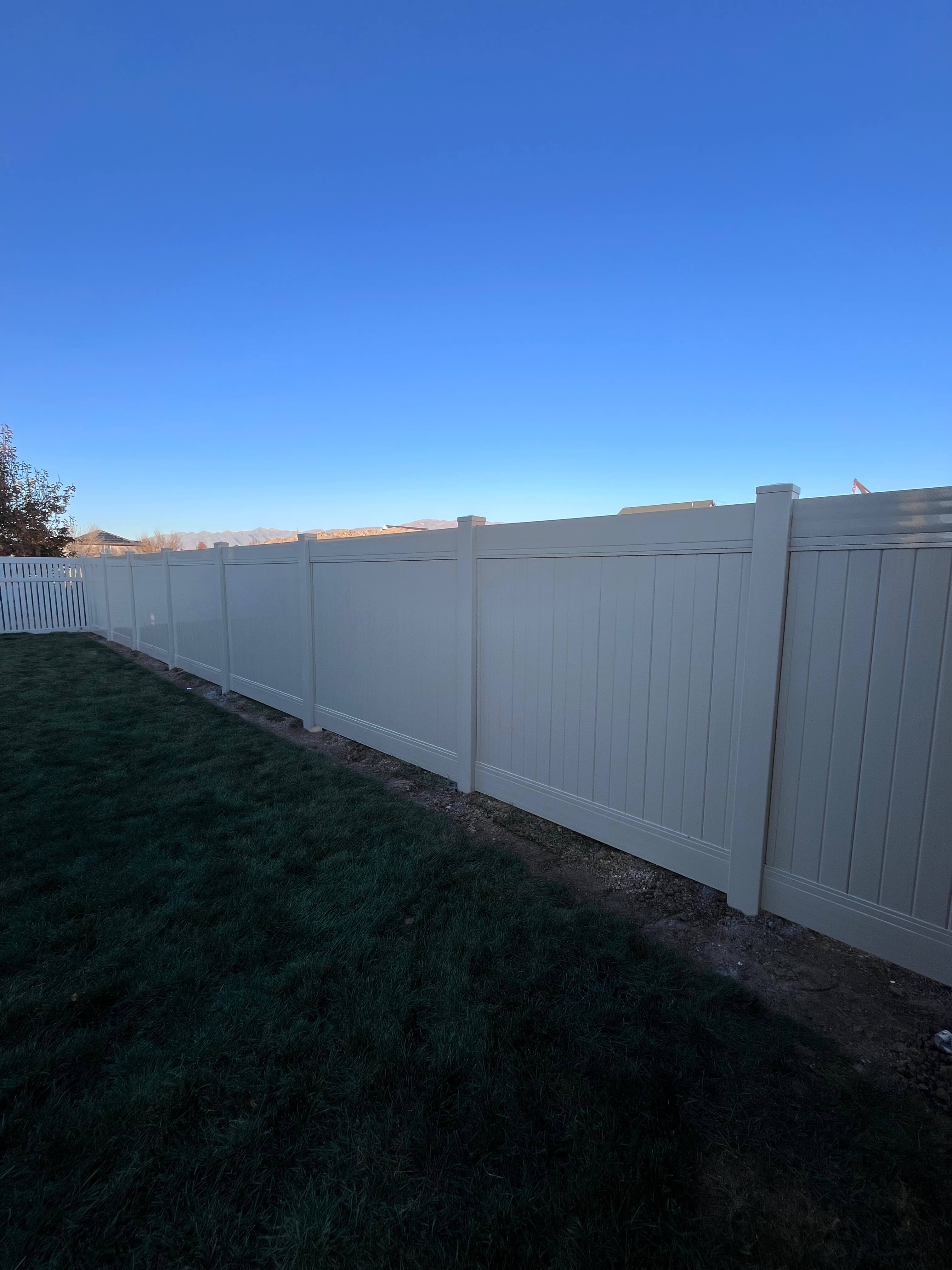 Tall white vinyl privacy fence built by Trusted Fence in Salt Lake City