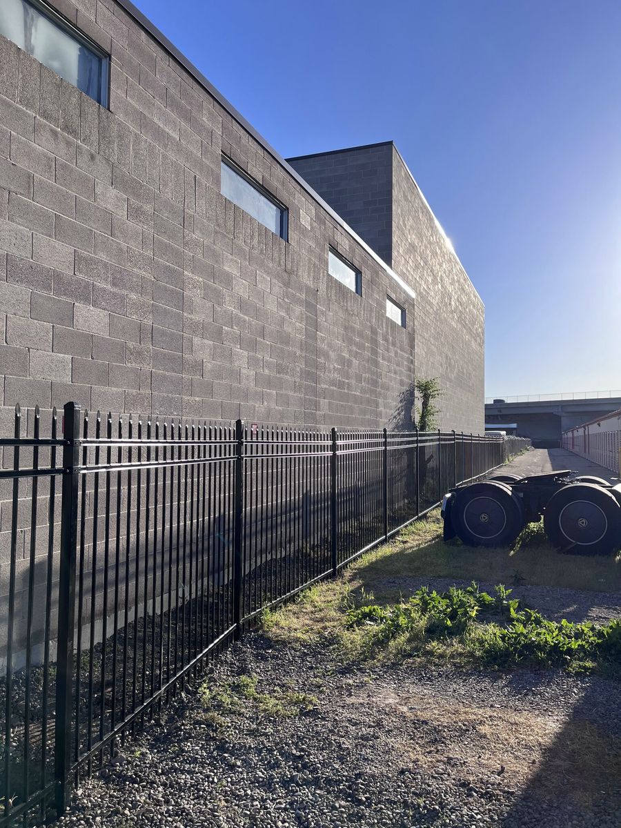 Black ornamental iron fence along a commercial building in Salt Lake City, UT